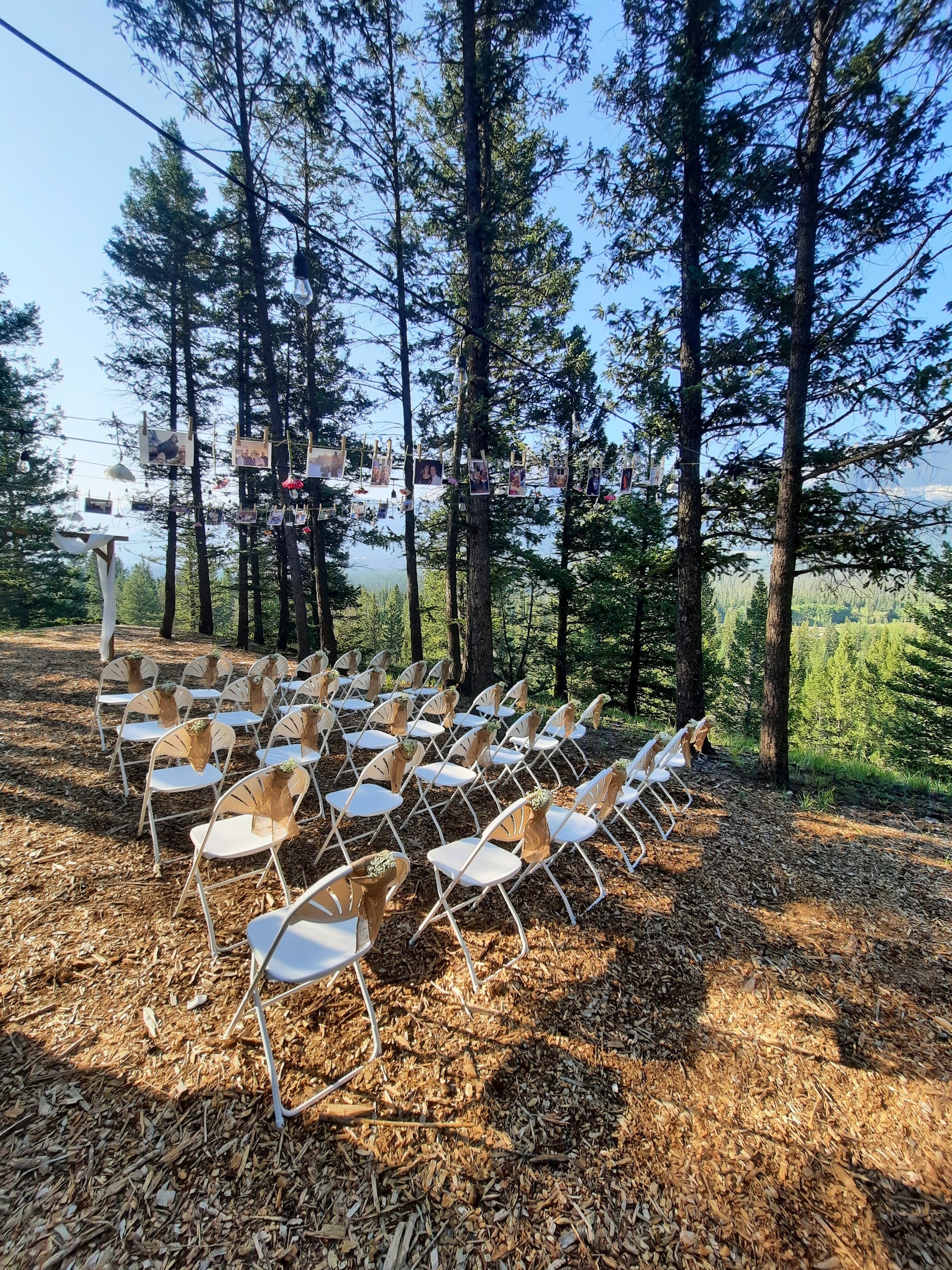 Snow white, fan back, folding chair. Seating view.